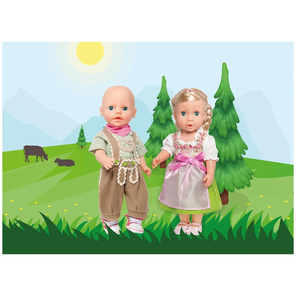 Heless knickerbockers with shirt 3-piece set includes two dolls in fabric outfits against a vibrant green field and blue sky.