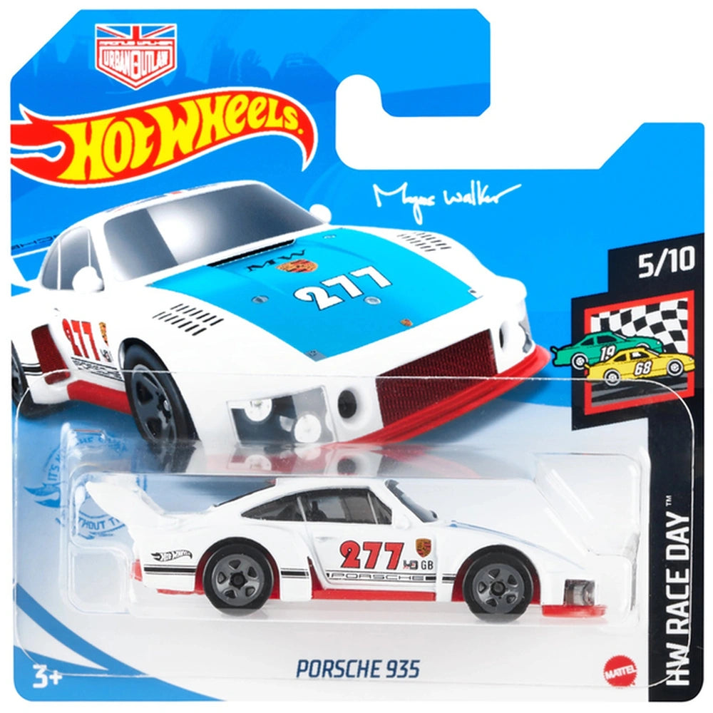 Hot Wheels Porsche 935 die-cast vehicle in red, white, and yellow, displayed in blue cardboard packaging with racing flag.