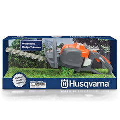Husqvarna toy hedge trimmer in blue cardboard packaging with a transparent window displaying a grey and orange trimmer and gr