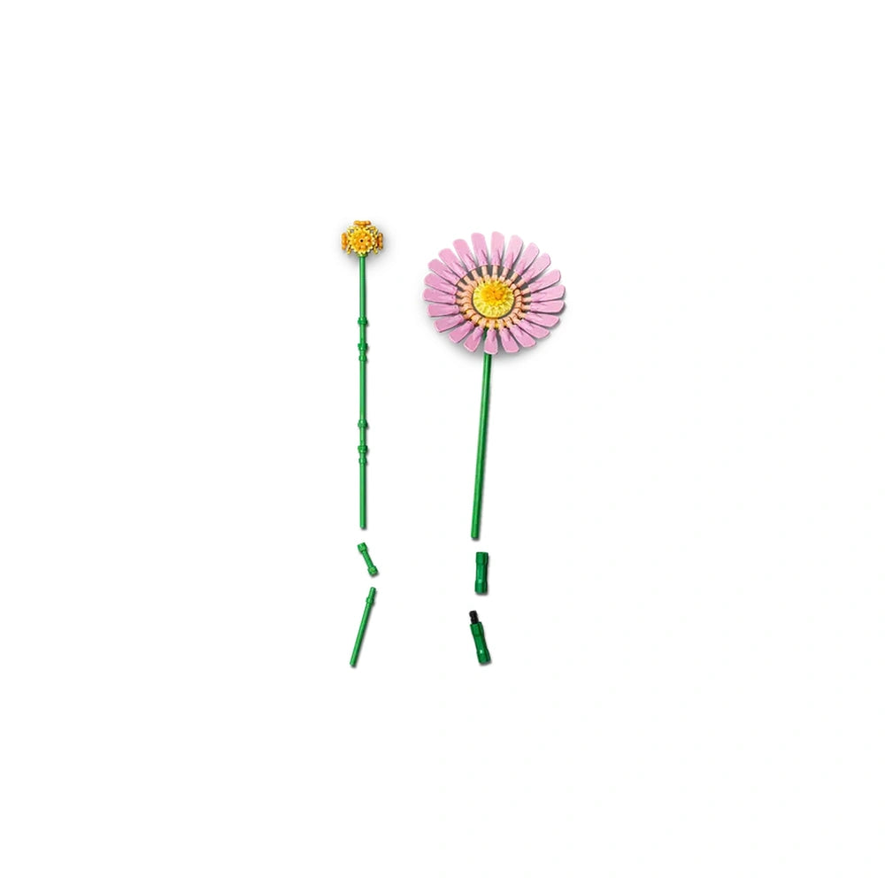 Two LEGO® flowers: a vibrant pink flower and a yellow flower, both on green stems. Additional green pieces for customization are visible.