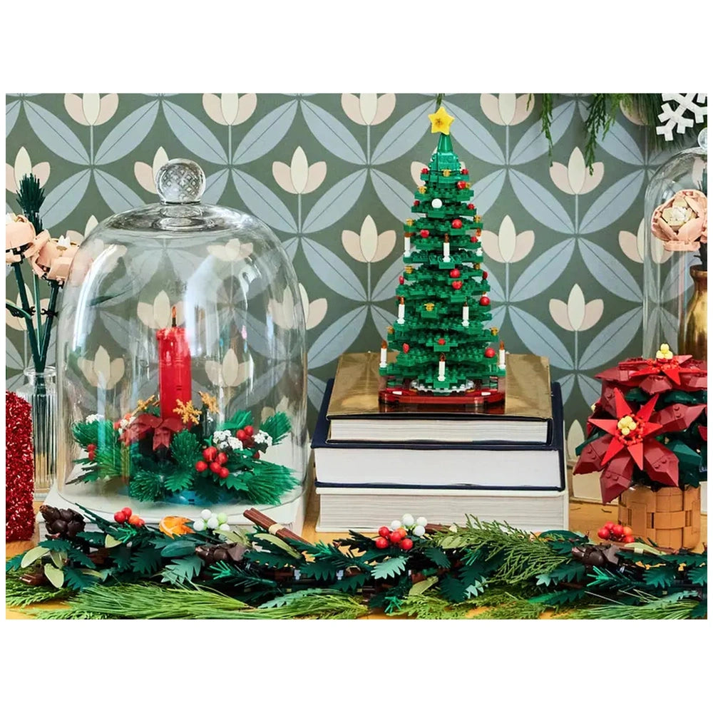 LEGO Christmas Table Decoration featuring a green tree with colorful ornaments and candles, a red candle under glass, and festive foliage.