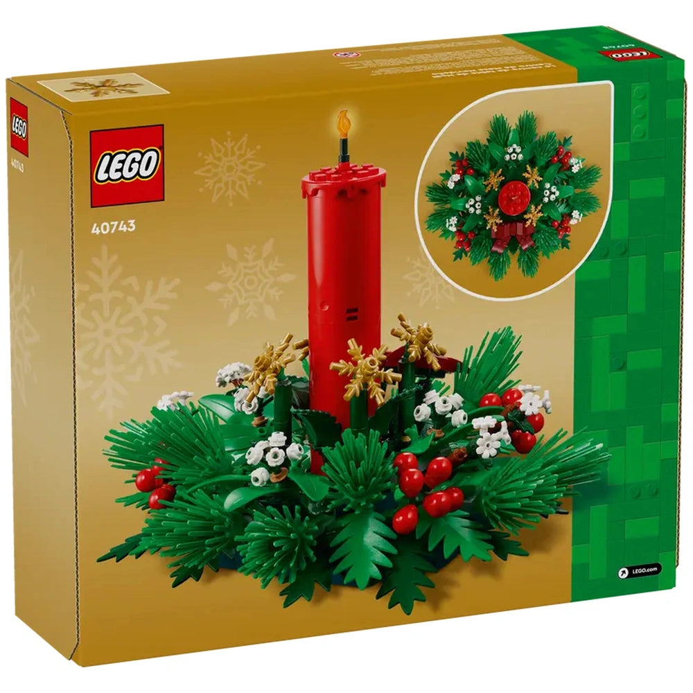 LEGO® Christmas Table Decoration set features a bright red candle surrounded by green foliage, golden stars, and red berries on a festive box.