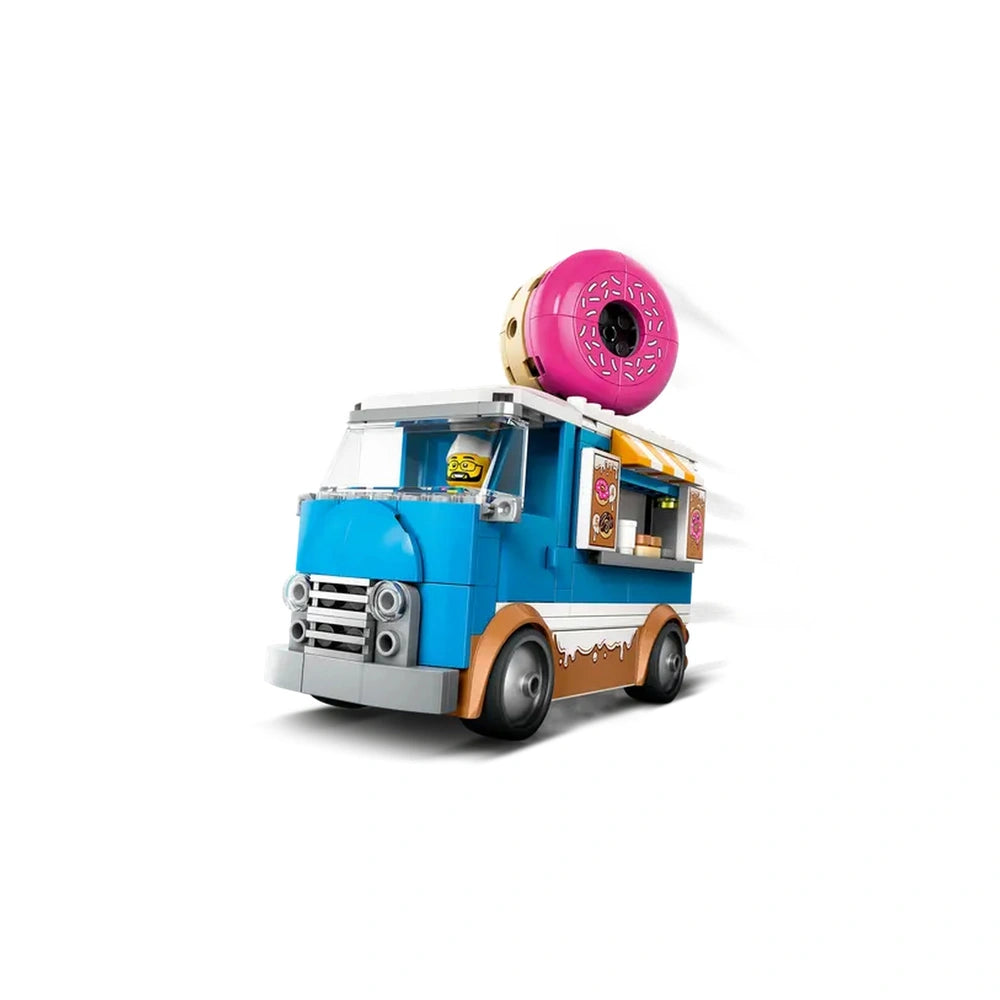 LEGO City Donut Truck playset with a bright blue body, large pink donut on top, and colorful decorations, showcasing a fun mobile donut shop.