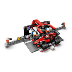 LEGO City F1 Pit Stop set featuring a red Ferrari race car and four pit crew minifigures, complete with accessories and pit stop elements.