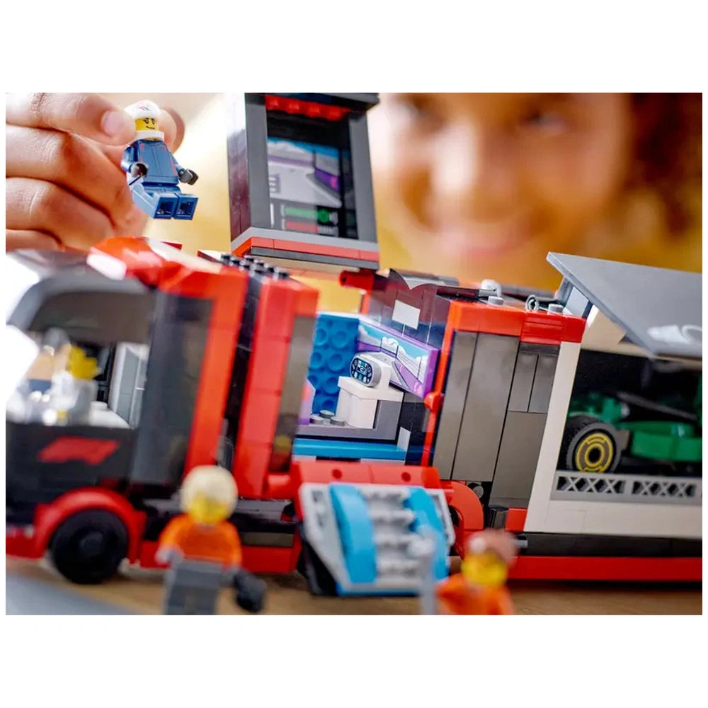 Colorful LEGO® F1® Truck construction set featuring a detailed transport truck, an open trailer, and a child holding a mini racer figure.