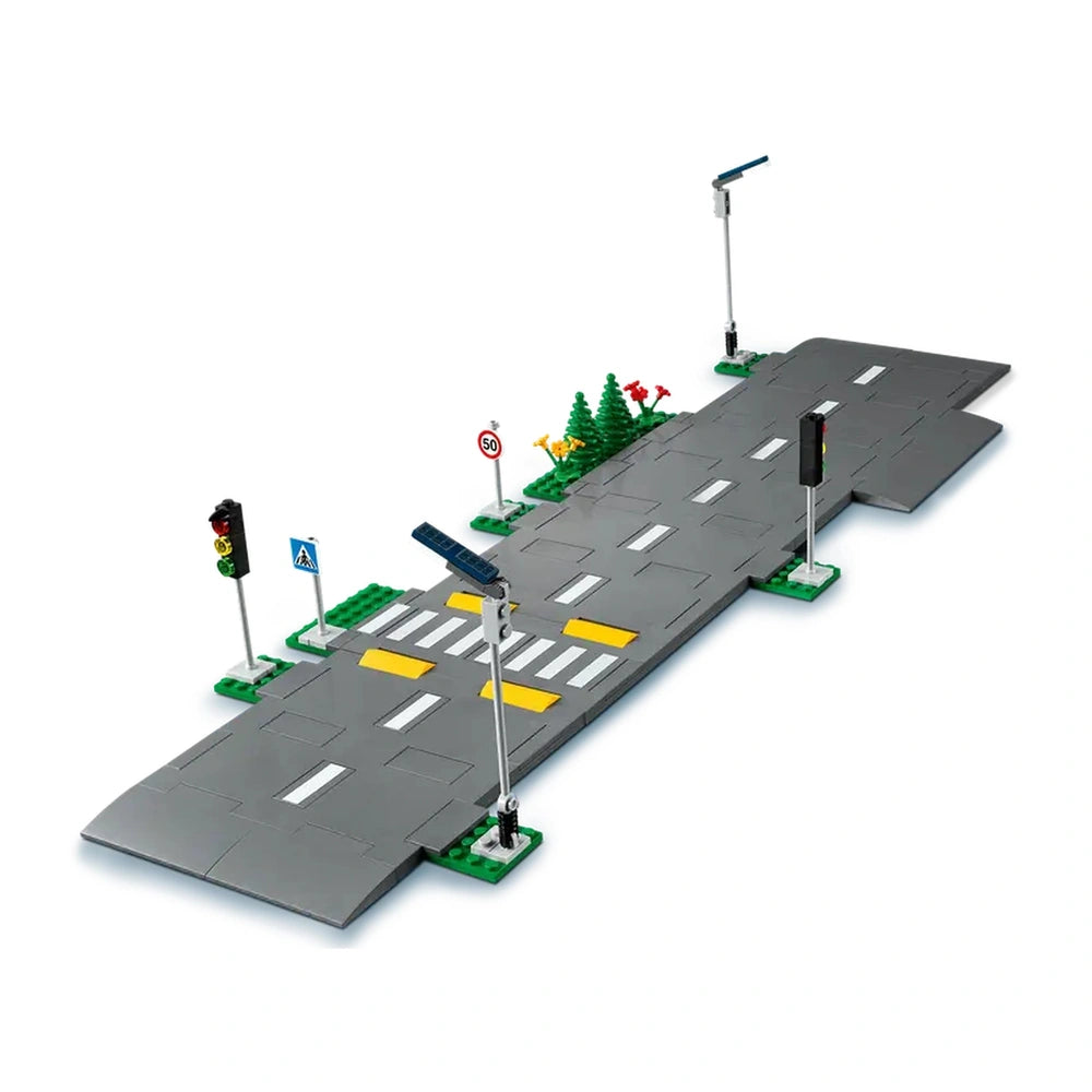 LEGO City Road Plates construction set featuring five road plates with traffic markings, crosswalks, streetlights, and greenery.