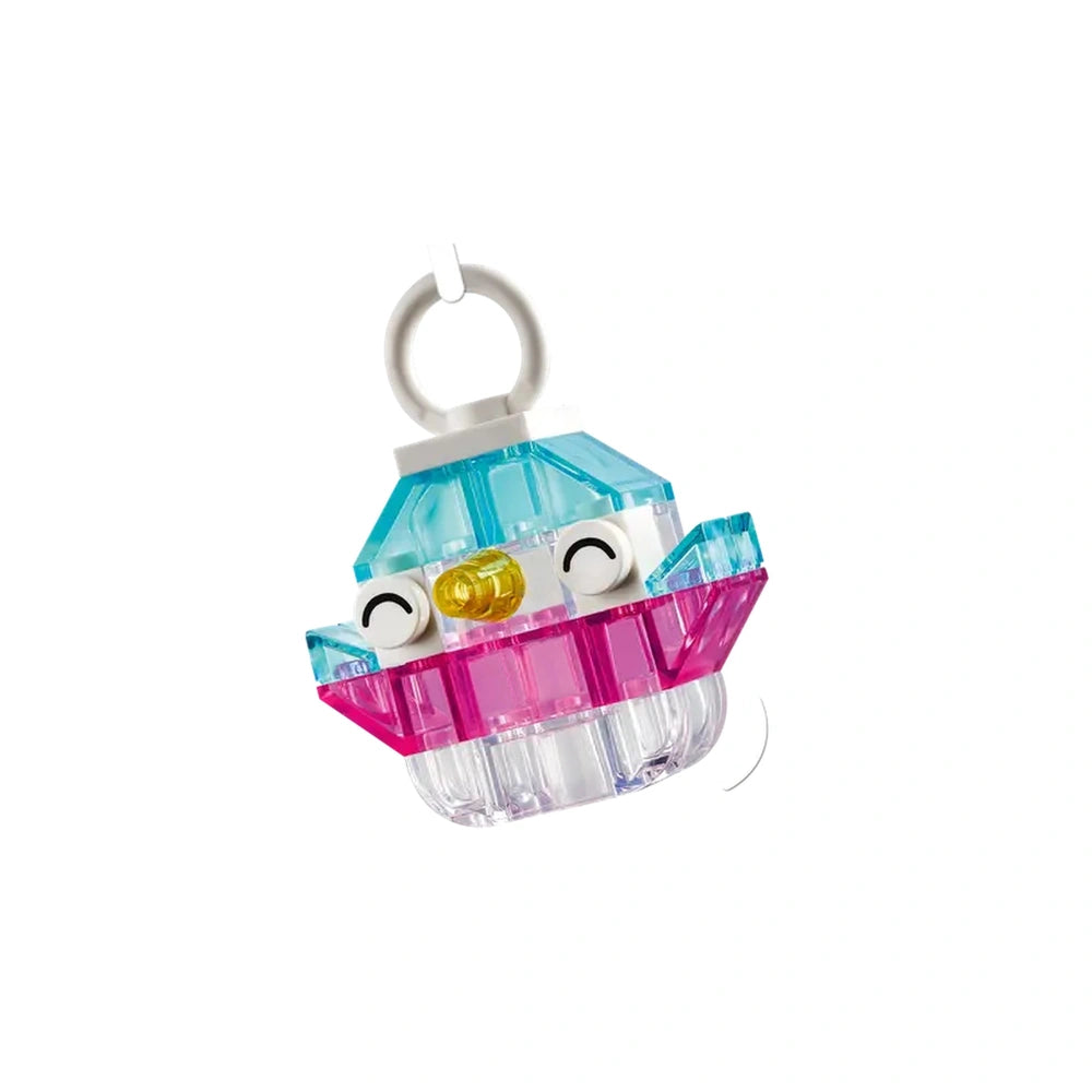 Vibrant LEGO® Classic Magical Transparent Box toy featuring a playful design with colorful transparent bricks in shades of blue and pink, showcasing smiling eyes and a cheerful expression. Ideal for sparking creativity in children.