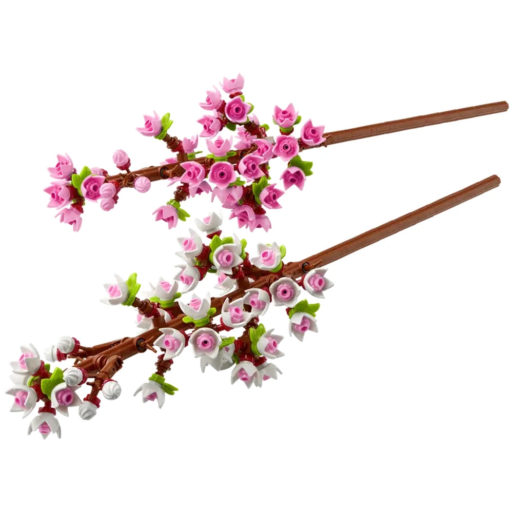 Two intricate LEGO® cherry blossom twigs, adorned with vibrant pink and white buds, resting on a brown branch against a plain background.