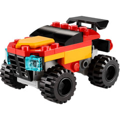LEGO Creator Mini Convertible Monster Truck in vibrant red, yellow, and black, featuring large black tires and detailed headlights.