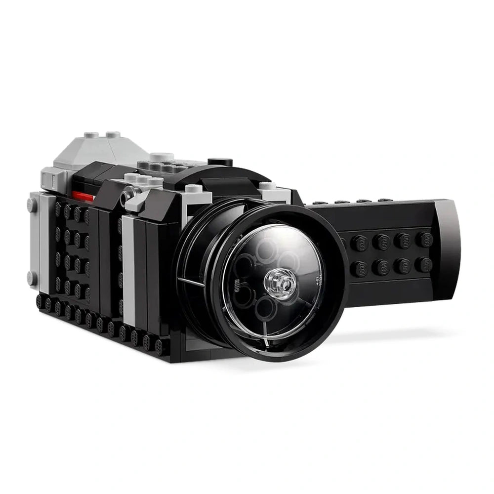 LEGO® Creator Retro Camera with a sleek black design, moving lens, and functional buttons, showcasing a fun, imaginative construction set.