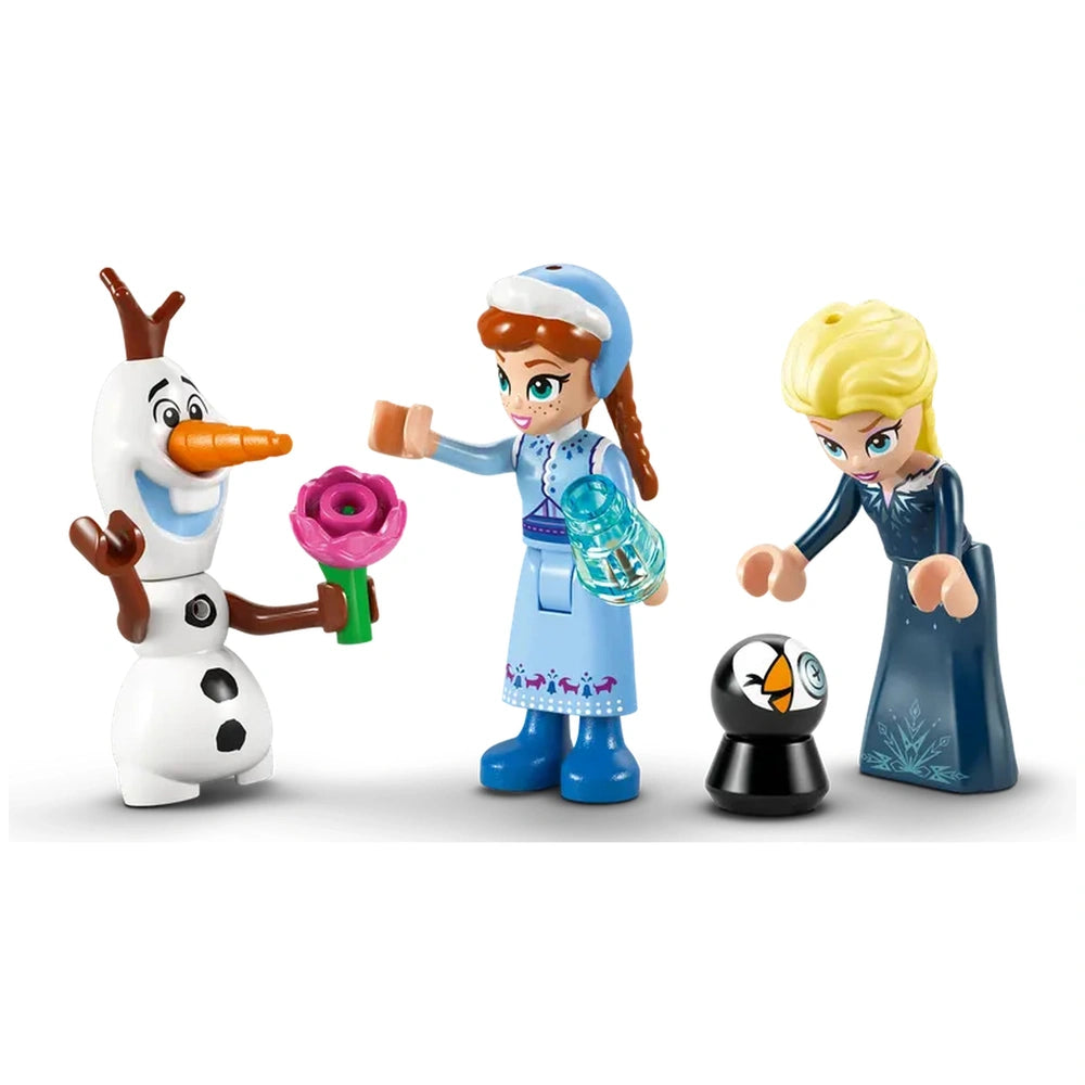 Elsa and Anna mini-doll figures from Disney's Frozen, standing beside Olaf holding a flower, with a small black figure nearby.