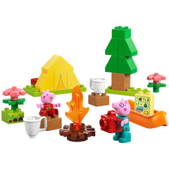 LEGO® DUPLO® Camping Trip set featuring a yellow tent, campfire, Peppa Pig with a red camera, and a toy canoe, surrounded by colorful flowers and trees.