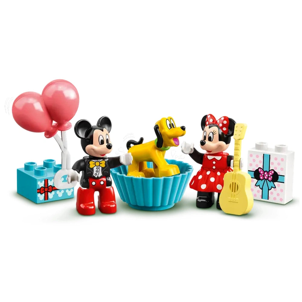Mickey Mouse and Minnie Mouse play with Pluto in a colorful blue bowl, surrounded by gift boxes and pink balloons.