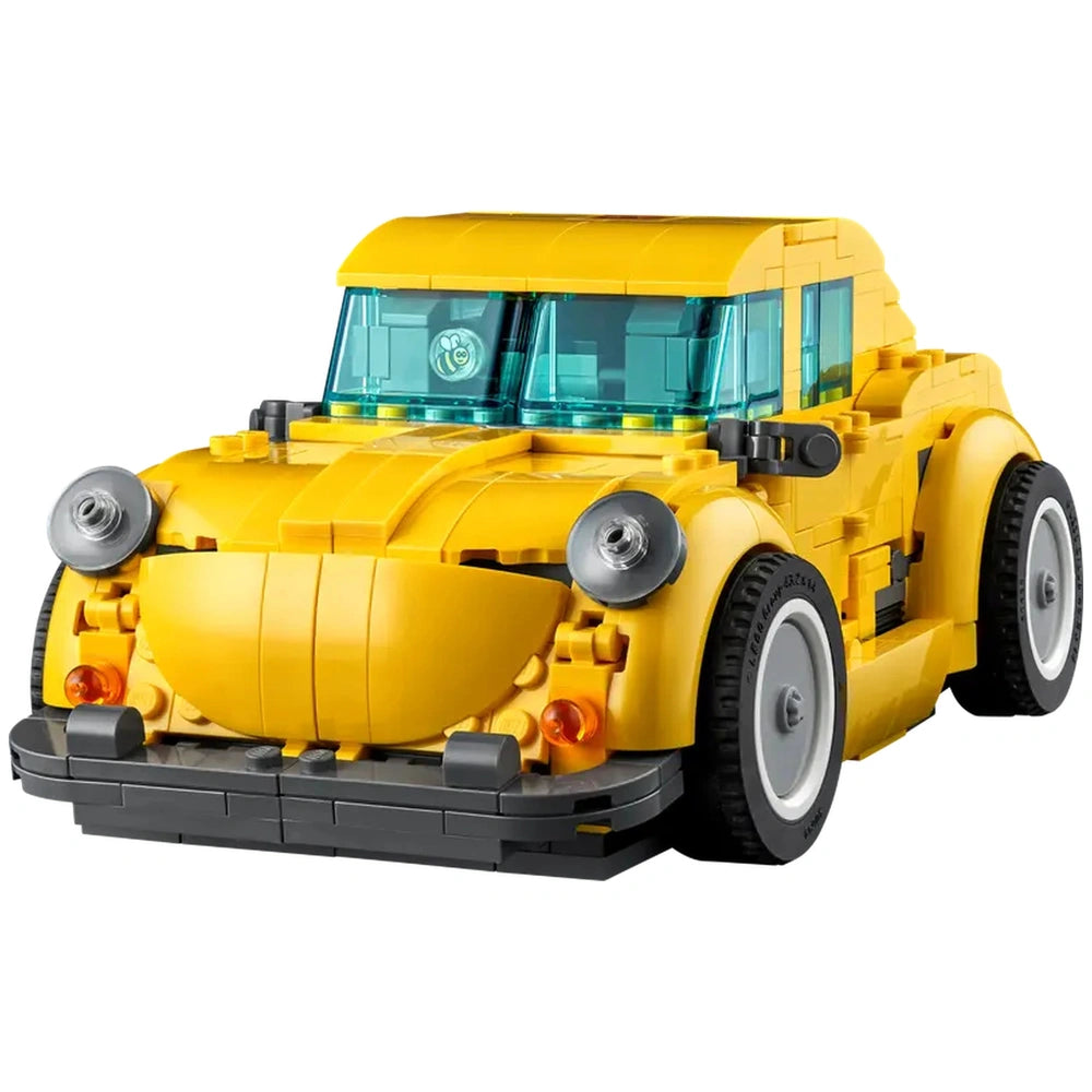 Detailed yellow LEGO® Bumblebee model with a friendly expression, featuring two turquoise windows, chrome accents, and a black bumper.