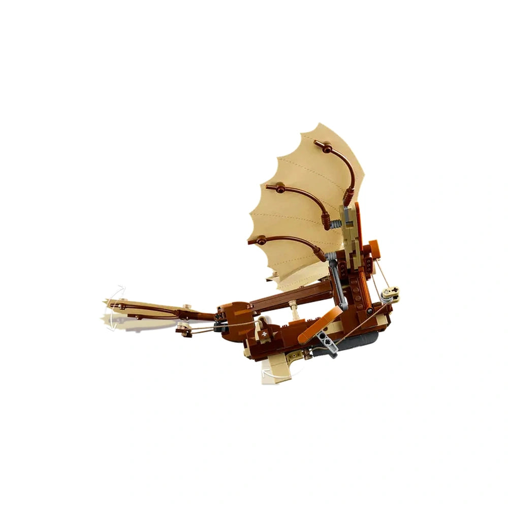 LEGO® Icons Leonardo da Vinci's Flying Machine model featuring detailed textured wings, intricate mechanics, and a wood-like color scheme.
