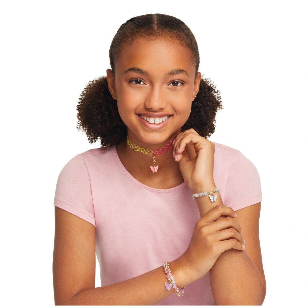 Butterfly Jewelry Set features a girl with black curly hair wearing a pink heart necklace and butterfly bracelets.