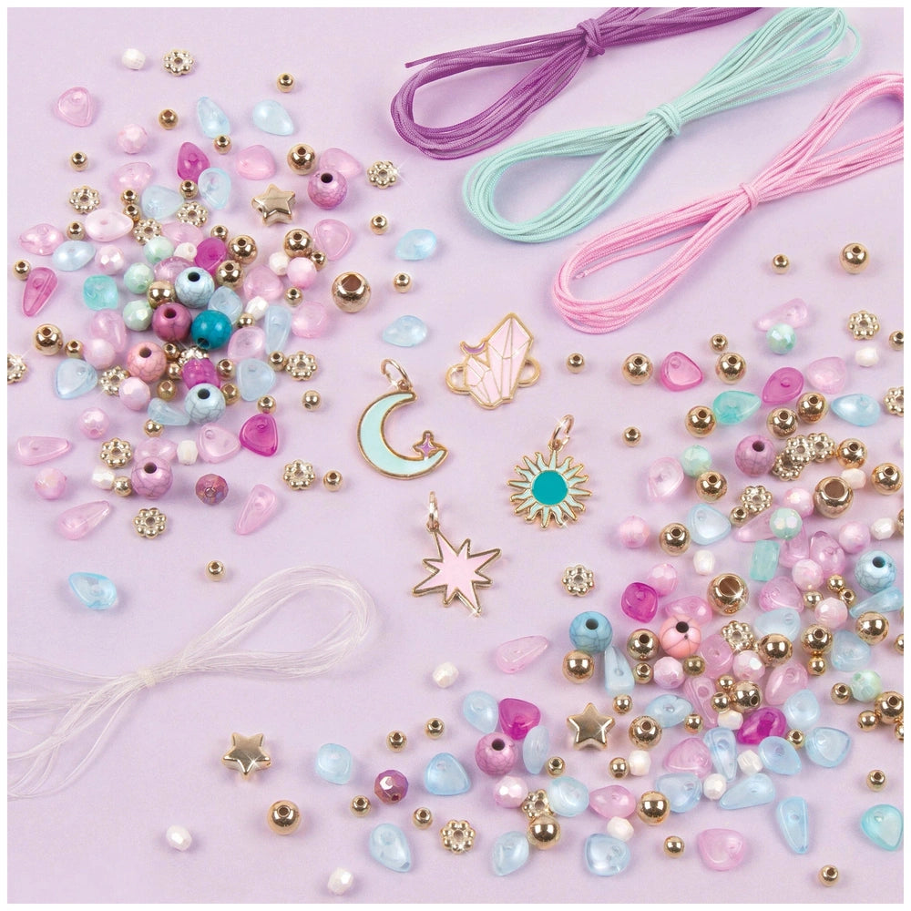 Celestial Stones Bracelets feature a variety of glossy and matte beads in pink, blue, green, and white on a smooth light purp