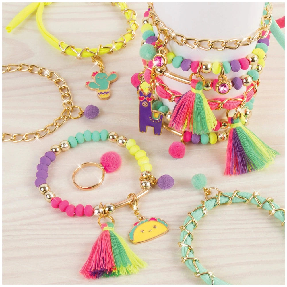 colorful beads, fuzzy tassels, and gold-tone findings arranged in a vibrant layout.