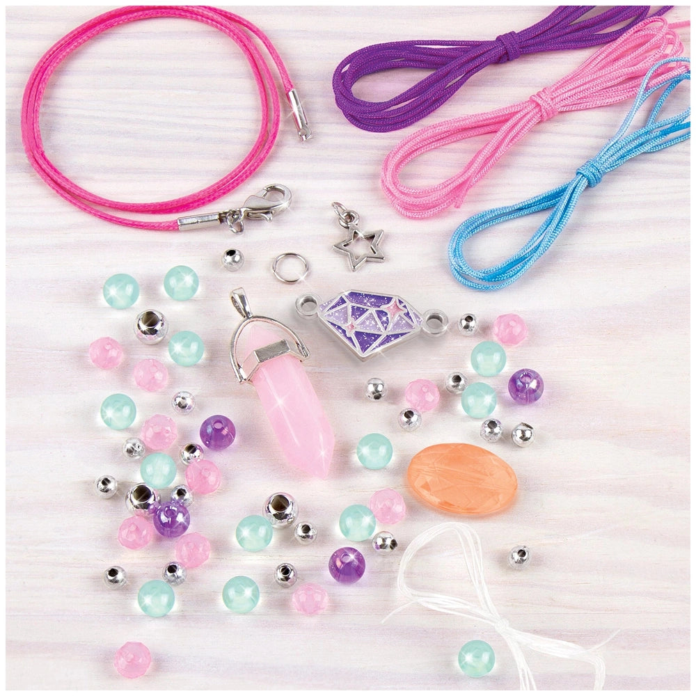 Positive Gems Jewelry set featuring colorful rubber bands and assorted plastic bead accessories including necklaces, bracelet