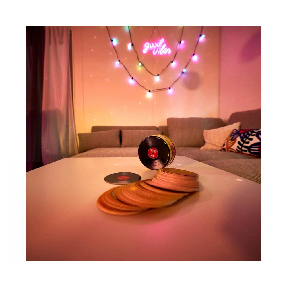 Music-Buster Music Trivia Game displayed in a cozy, colorful living room with vinyl records and modern décor.