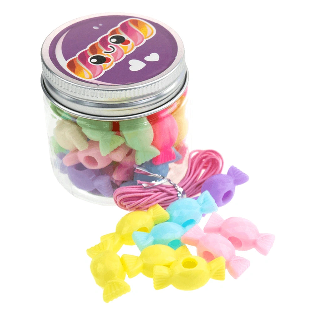 Beads ABC Candy Beads Jar featuring a purple decorative metal lid and clear container filled with colorful plastic fish and r