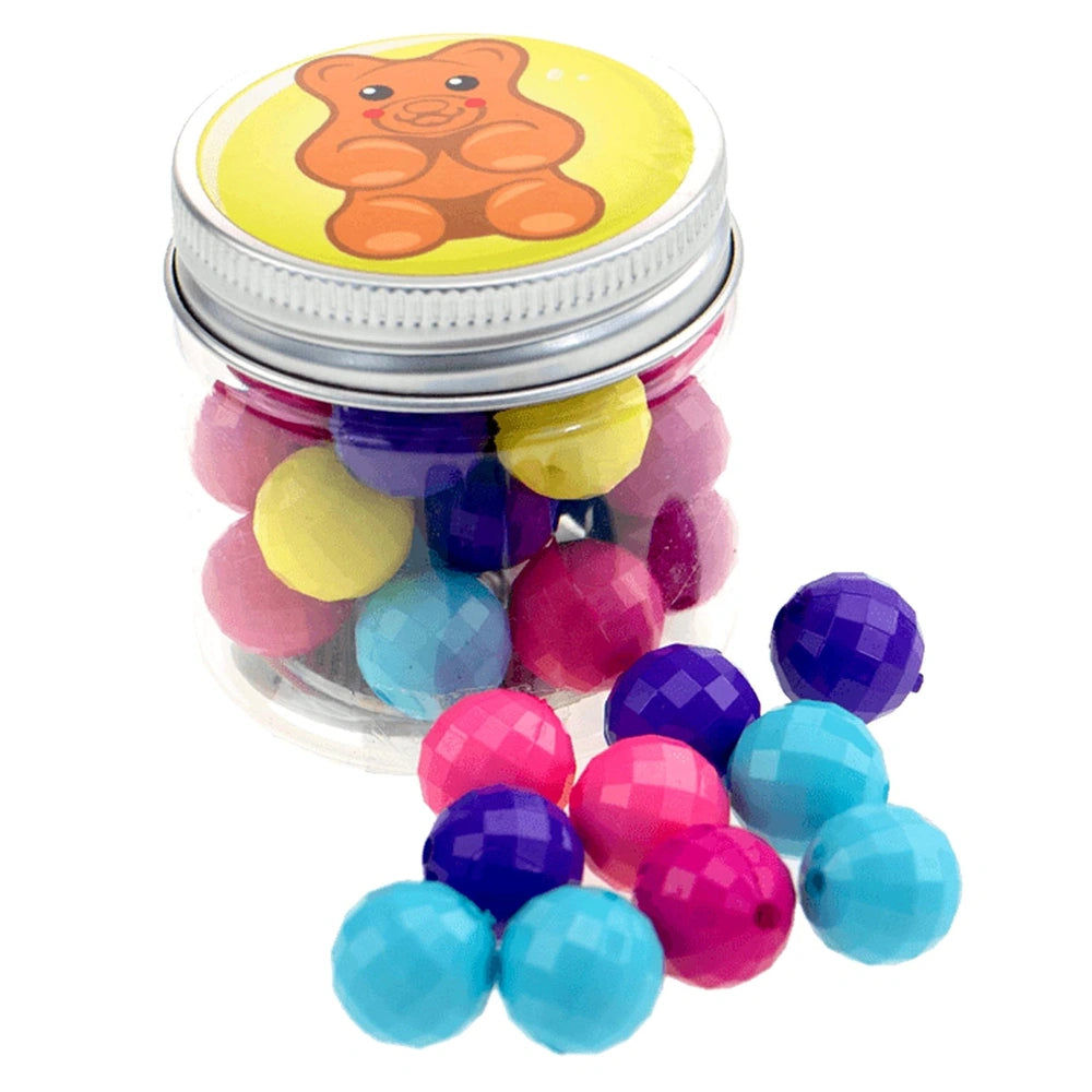 Beads ABC Candy Beads Jar features a clear plastic jar with a teddy bear graphic lid and colorful glossy plastic balls inside