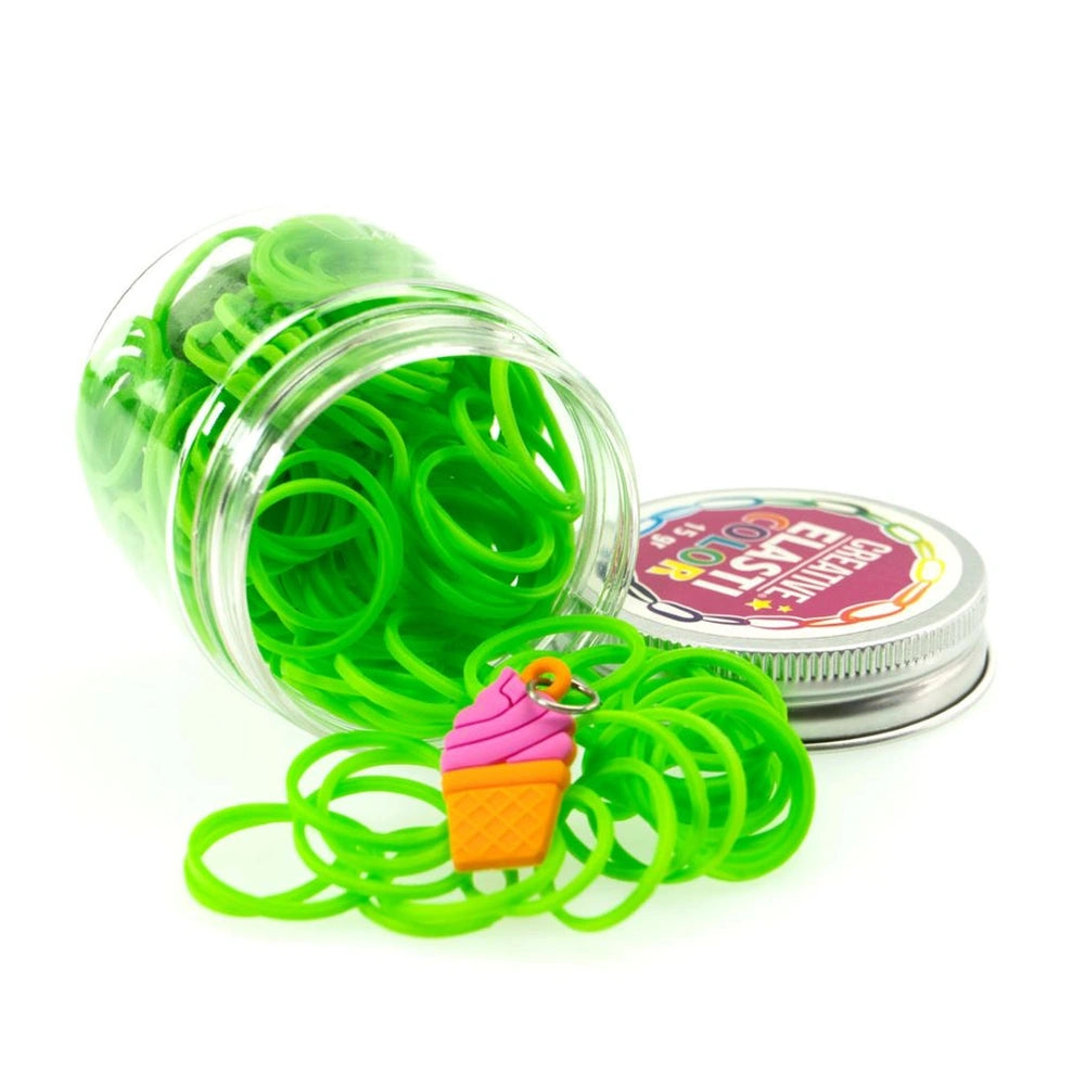 Elasticolor multicolor bands pack in a transparent jar topped with a pink and yellow hard plastic object and a metallic lid.