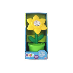 Flower bubble machine with yellow flower, green stem, and white center, housed in a blue cardboard box.