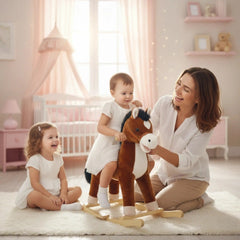 My Vip Rocking Horse in brown, surrounded by a child in a white dress and a woman on a pink and white decorated floor.