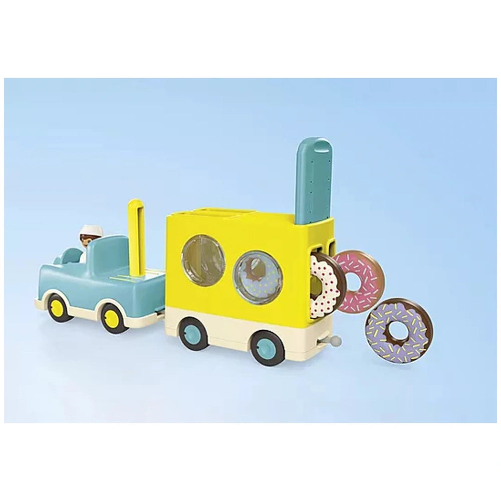 Playmobil Crazy-Donut-Truck features a yellow plastic truck with black wheels, a flatbed, and assorted brown and white donuts