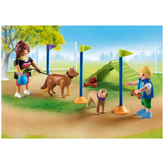 PLAYMOBIL Dog Park playset features a female figure in a black top with a dog on a leash, holding a blue ball in a grassy are