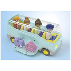 Playmobil Junior Airport Shuttle Bus toy features a white body, rubber yellow tires, blue seats, and includes 4 figures and 2
