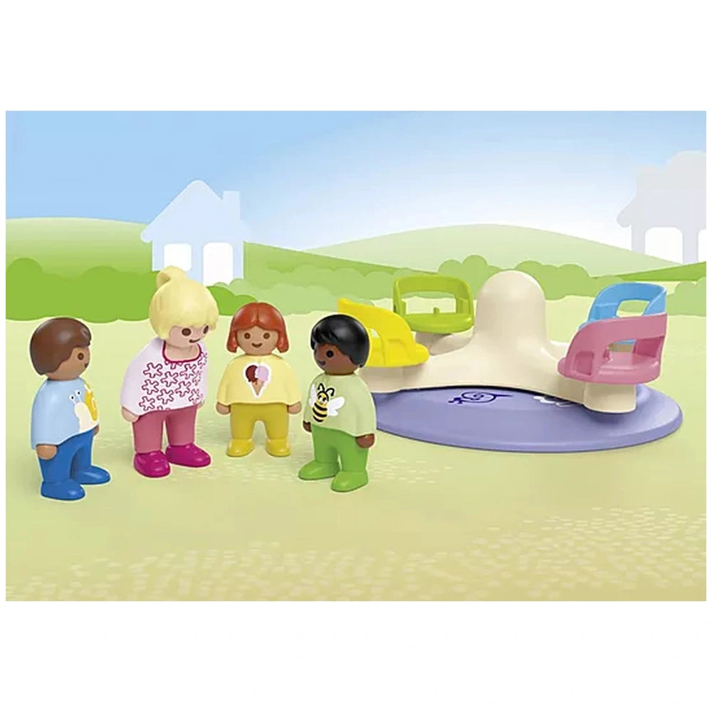 Playmobil Junior Number Merry-Go-Round toy set features five plastic figurines on light yellow ground with a blue sky backdro