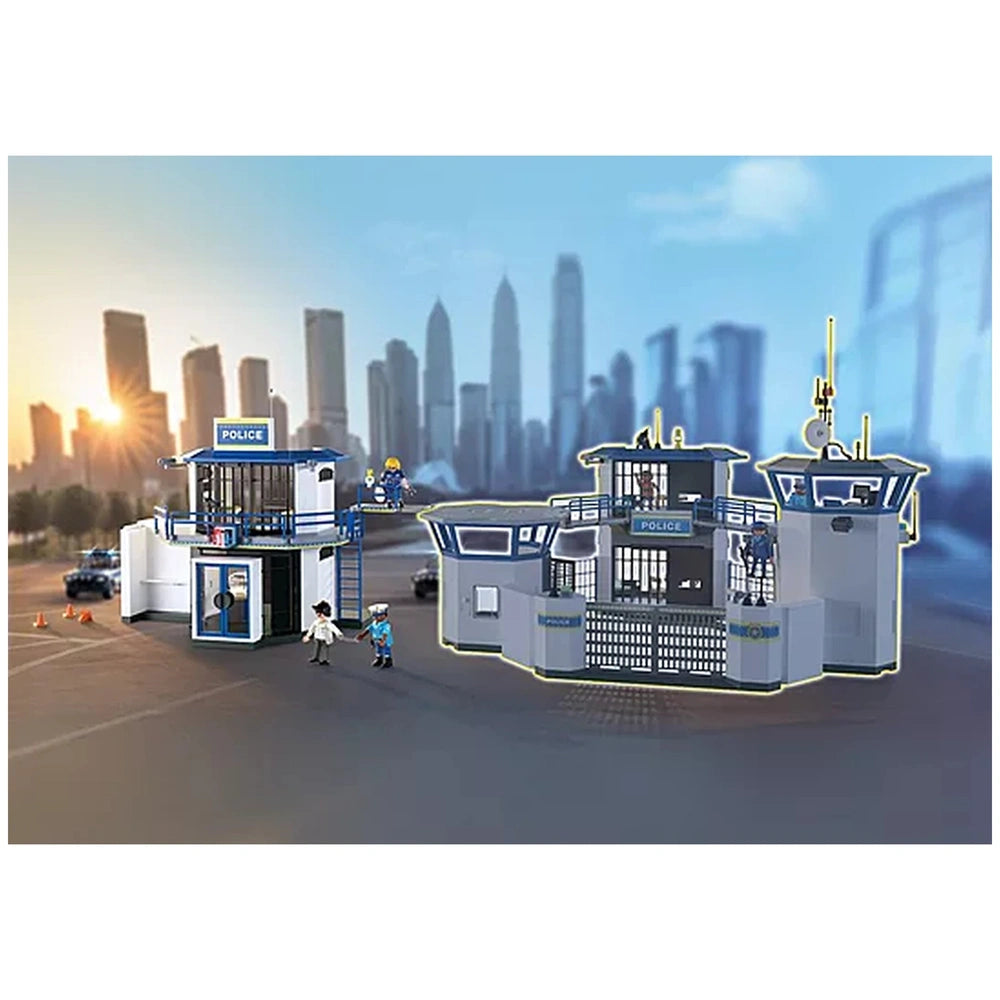 Playmobil Police Station toy playset featuring a white building with blue accents, central entrance, and multiple windows.