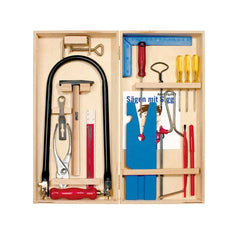 Wooden box with fretwork tools, including a fretsaw, hammer, pliers, rulers, screwdriver, colorful templates, and a manual.