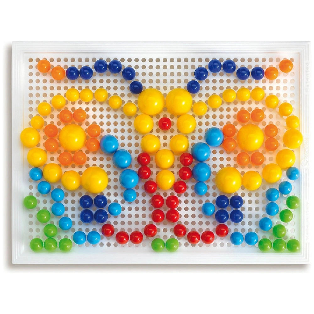 Quercetti FantaColor Tab features a plastic tray with holes and colorful plastic balls in yellow, blue, red, and green.