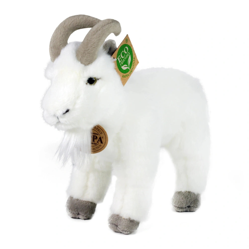 Plush goat stuffed animal with a white coat, grey hooves, curved horns, and eco-friendly tag, standing against a light backgr