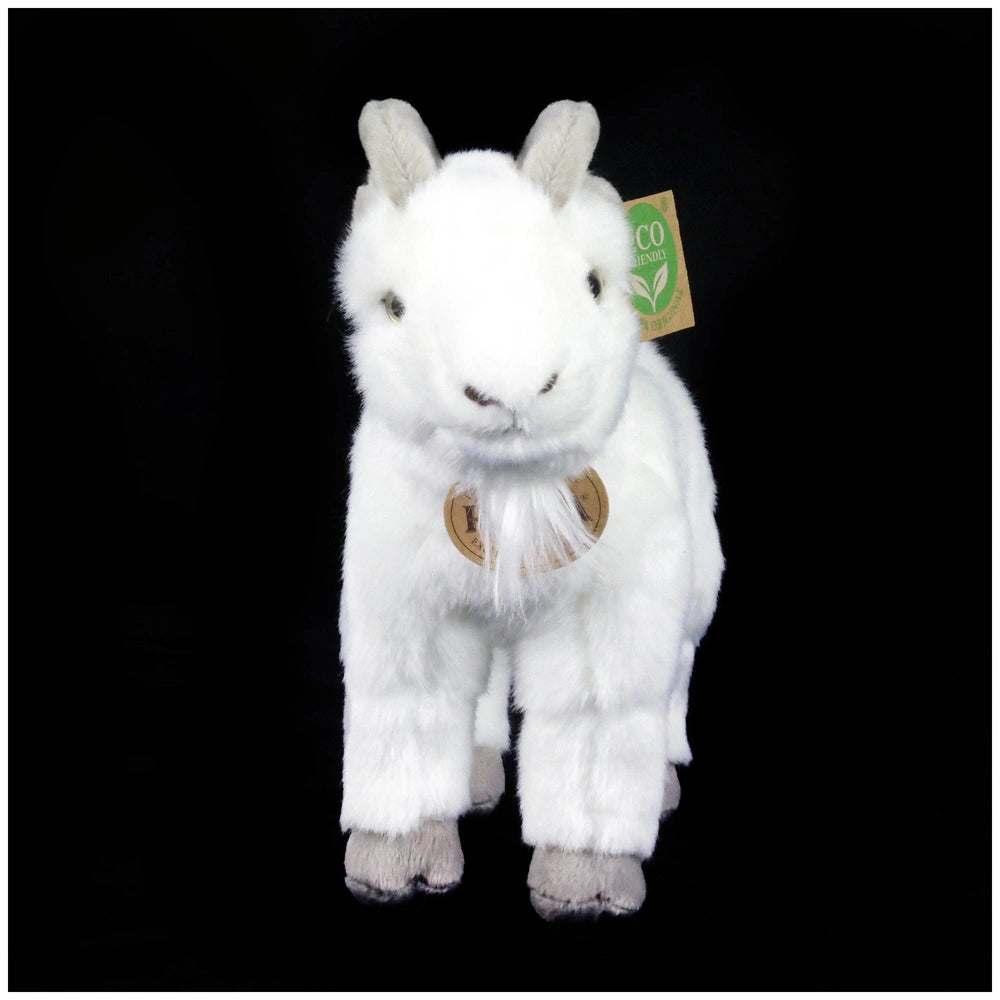 Plush goat toy with fluffy white fur, black eyes, and eco-friendly tag featuring a green leaf symbol, set against a black bac