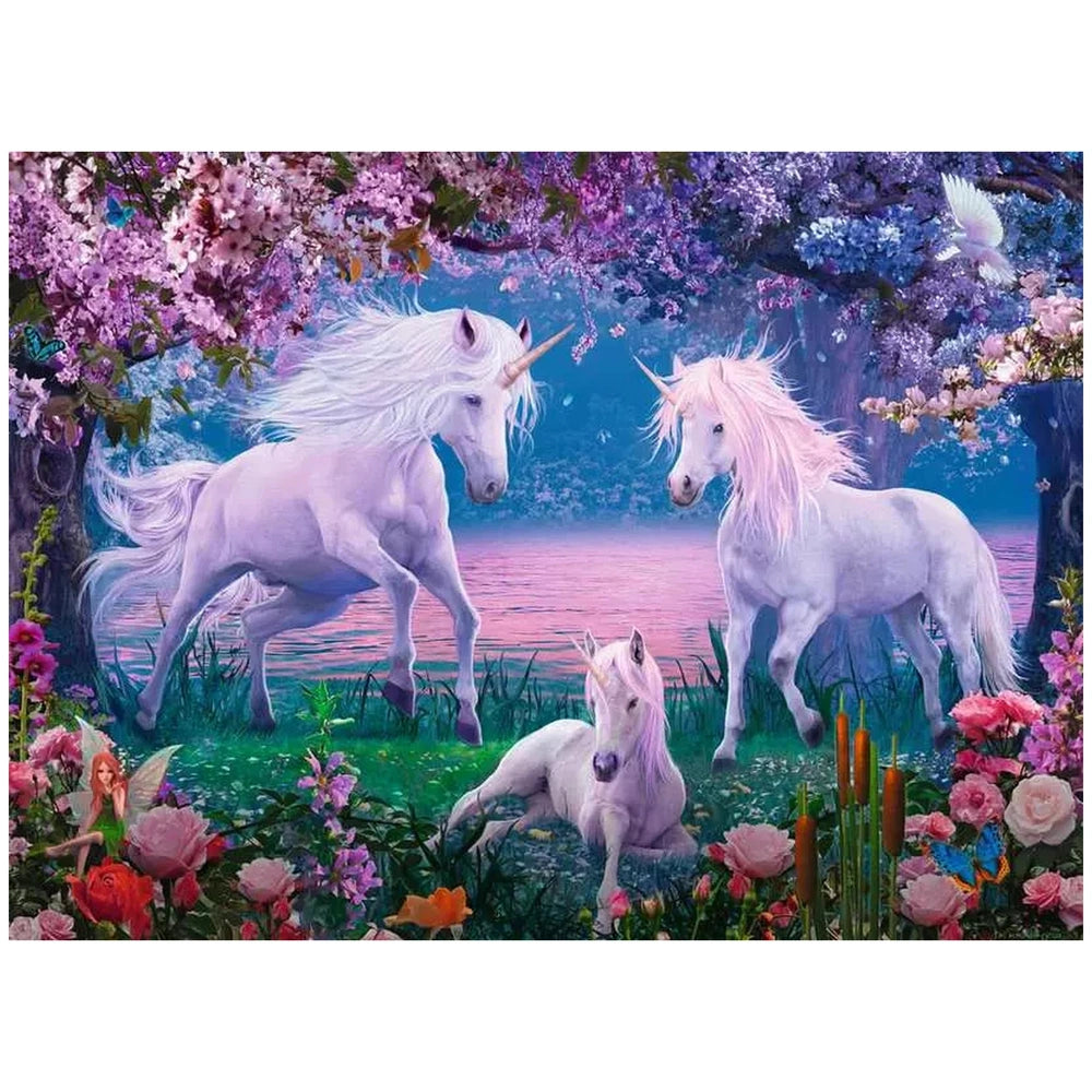 Three whimsical unicorns stand in a vibrant flower-filled field under a pastel gradient sky at sunrise or sunset.
