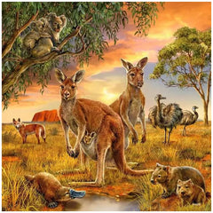 Ravensburger puzzle featuring kangaroos and emus in a vibrant natural scene with grass, water, and trees under a clear sky.