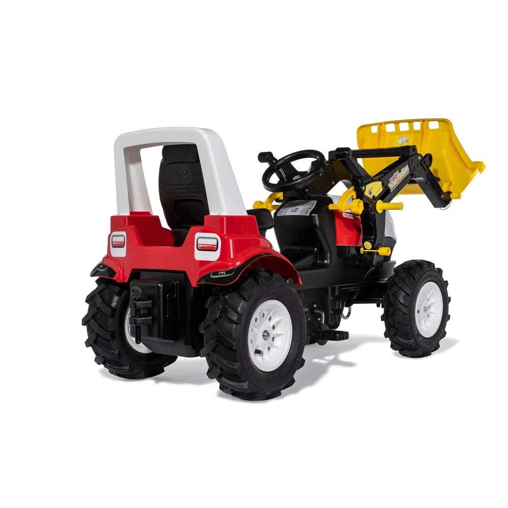 Rollyfarmtrac Premium II Steyr 6300 Terrus CVT toy four-wheeler in red and black with a white seat and black wheels.