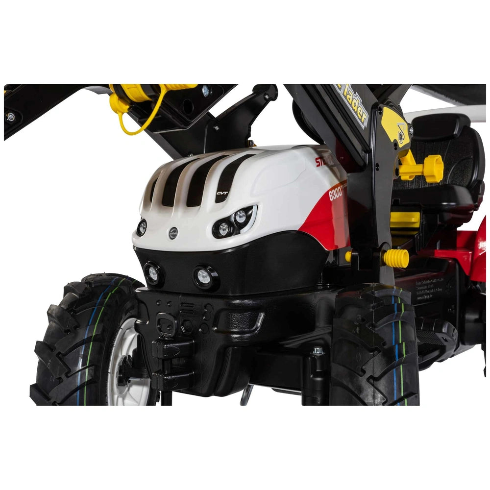 Rollyfarmtrac Premium II Steyr 6300 Terrus CVT features a sleek black design with red and white accents, showcasing its front