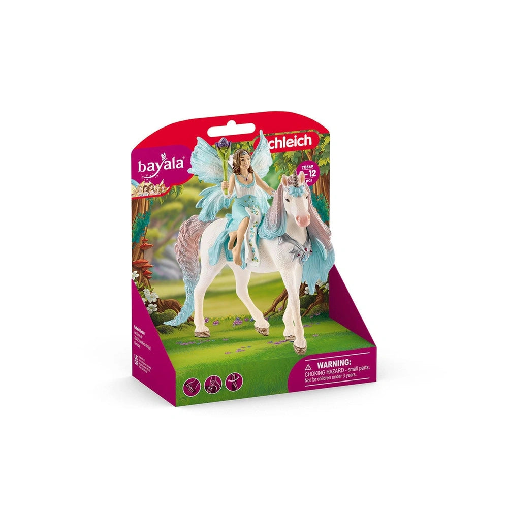 Fairy Eyela figurine riding a white unicorn in a fantasy setting with green field and tree on the packaging.