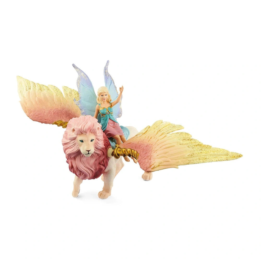 Fairy figurine in flight on a winged lion, featuring pink, gold, and blue colors with smooth, glossy surfaces.