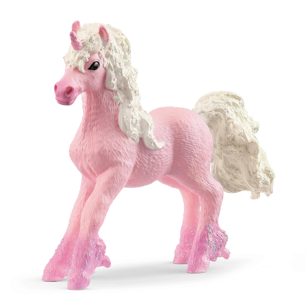 Pink unicorn foal figurine with a glossy finish and textured mane, standing upright on a plain white background.