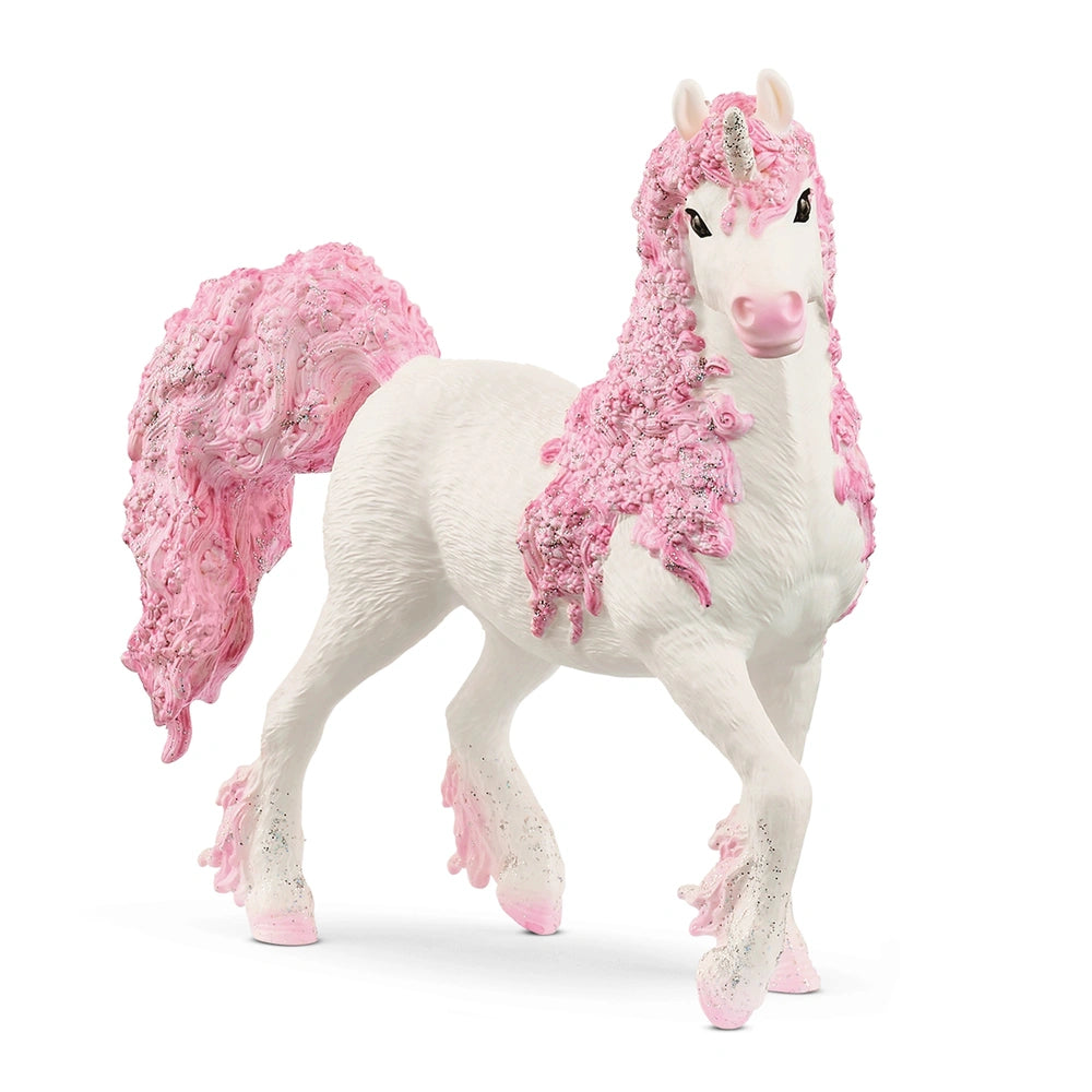 White unicorn figurine with pink accents, featuring a fluffy mane and tail, standing on a light background.