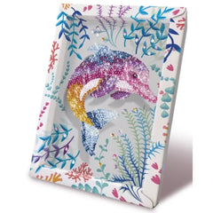 Ceramic decorative tray featuring a vibrant dolphin motif surrounded by colorful flowers and leaves, reflecting light.