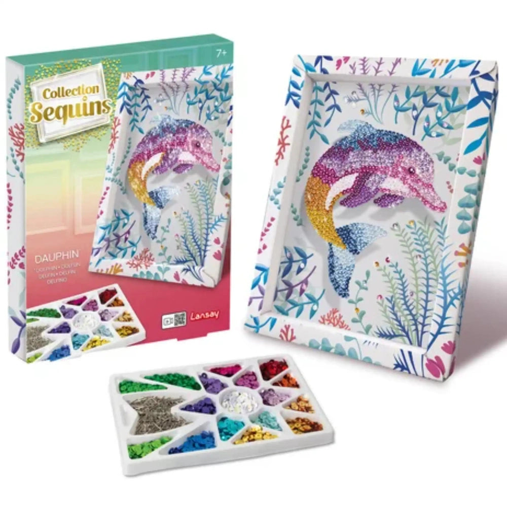 Collection of colorful sequins in various shapes displayed on a white tray, featuring a dolphin-themed box design.