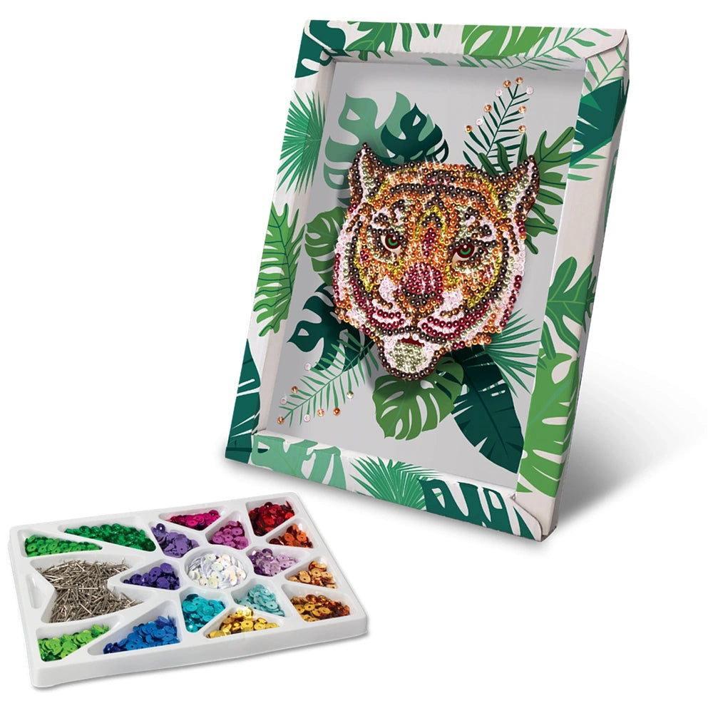 Colorful tiger-shaped object made of beads, displayed in a leafy patterned frame on a palette of assorted colorful stones.