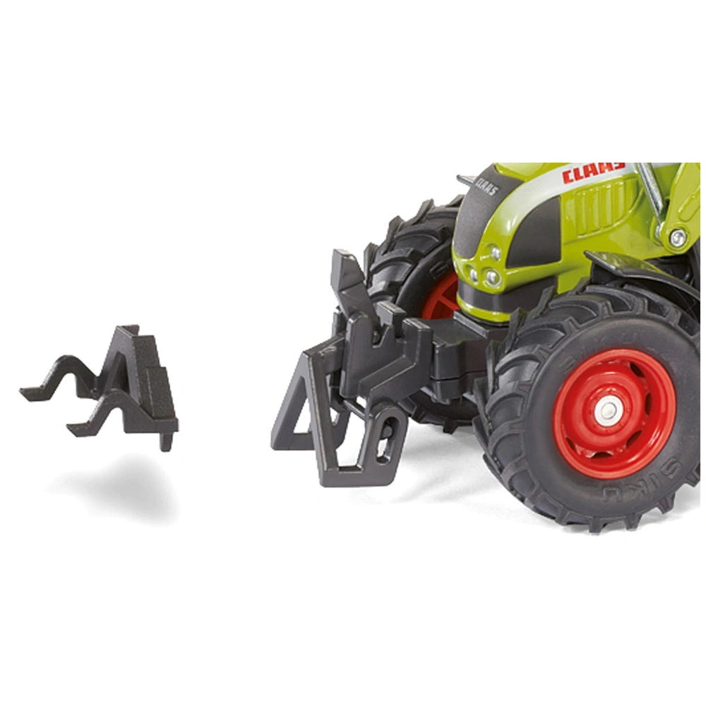 Green and black toy tractor with textured tires and a black front bumper, set against a white background.